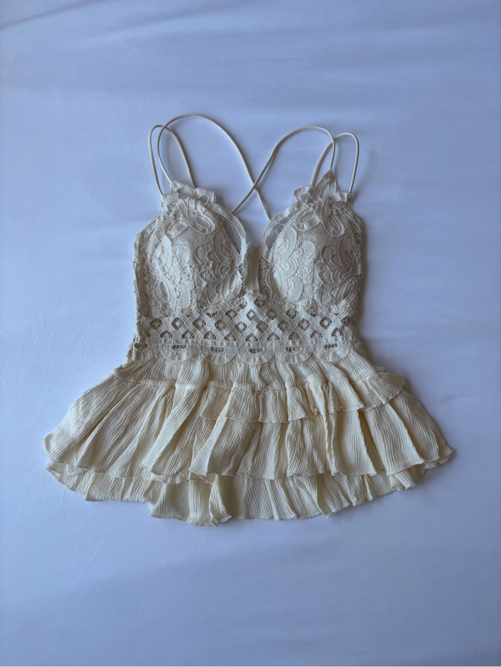 ZENANA cream lace crop top with ruffled hem and criss-cross straps
